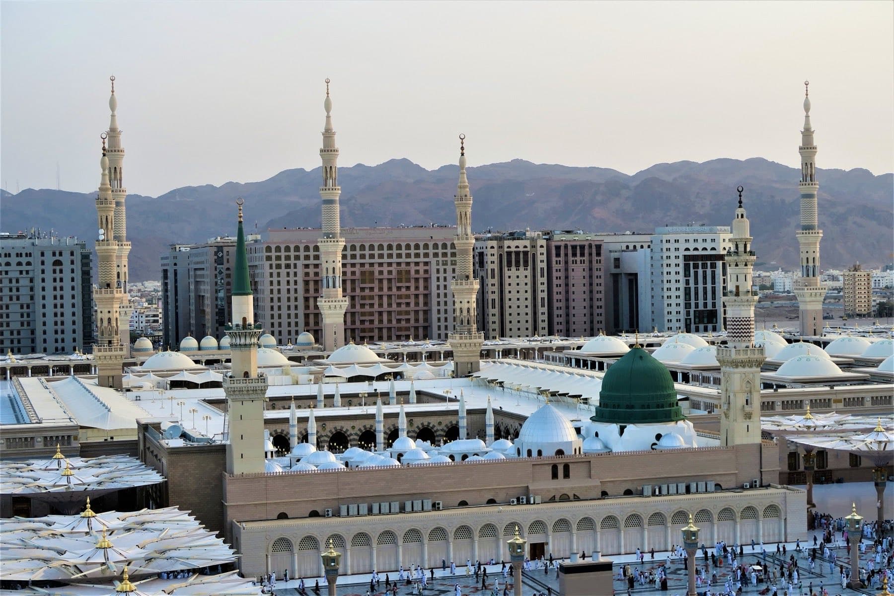 Masjid an-Nabawi in Madinah seen from above, its courtyards laid out around the mosque.