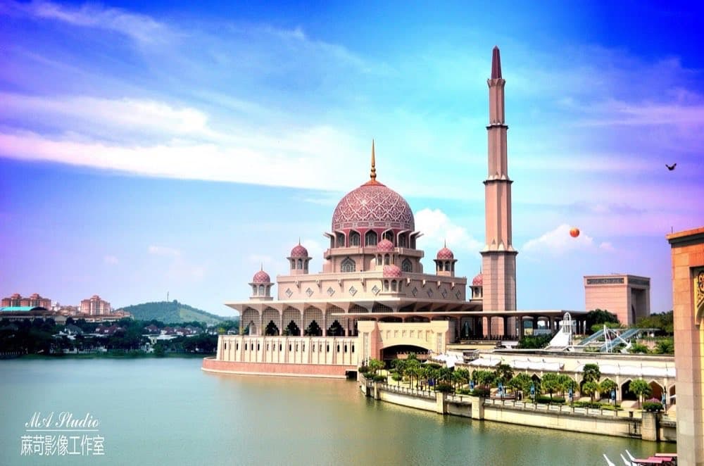 The pink dome and minaret of Putra Mosque in Putrajaya, Malaysia.